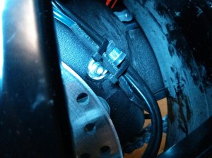 Routing along brake hose